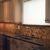 DeMane Design
Backsplash: stone, glass, metal